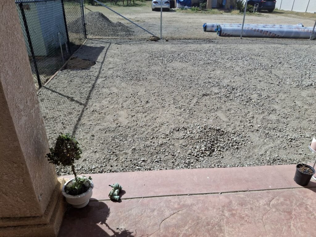 Compacted base ready for turf at a dog run installation