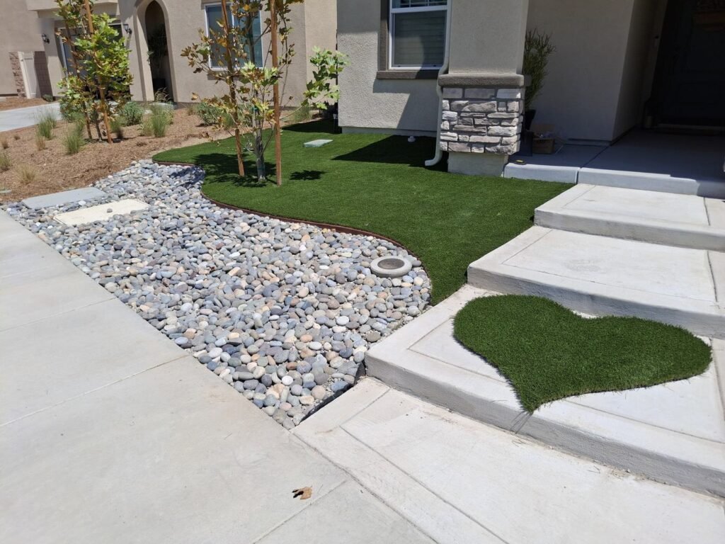Front yard after artificial grass, with a turf heart at the steps
